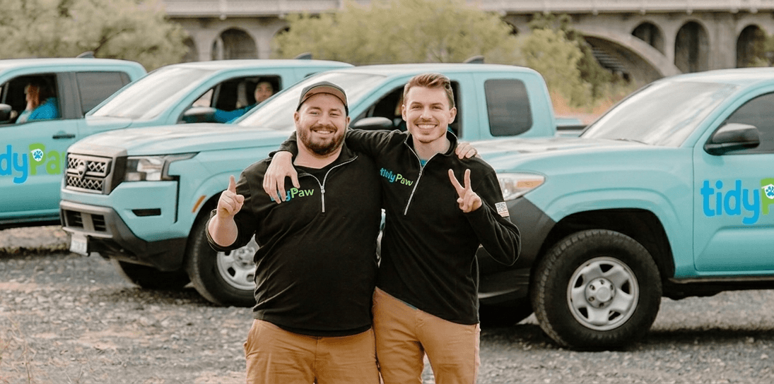 TidyPaw technicians with service vehicles